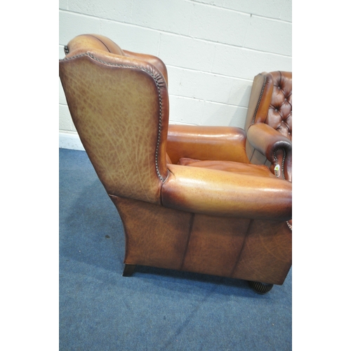 1324 - A PAIR OF OSKAR TETRAD TANNED LEATHER WING BACK ARMCHAIRS, with buttoned back and studded detail to ... 