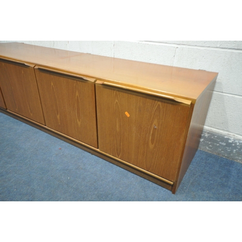 1199 - A MID-CENTURY TEAK SIDEBOARD, with three cupboard doors, besides two drawers, length 183cm x depth 4... 