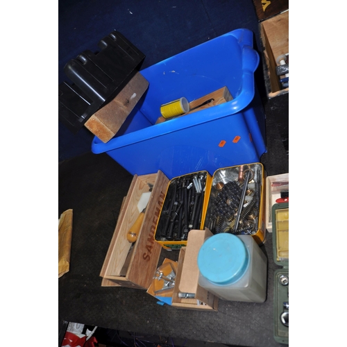 1094 - FOUR PLASTIC BOXES CONTAINING TOOLS including paint and pasting brushes, two mitre saws, a mitre blo... 