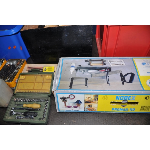 1094 - FOUR PLASTIC BOXES CONTAINING TOOLS including paint and pasting brushes, two mitre saws, a mitre blo... 