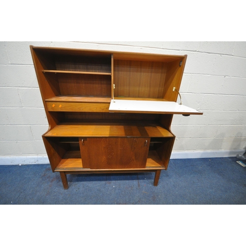 1203 - A MID CENTURY NATHAN TEAK HIGHBOARD, with an open bookcase section next to a fall front door, above ... 