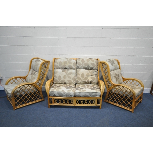 1207 - A WICKER FRAMED THREE PIECE CONSERVATORY SUITE, comprising a two seater sofa and two chairs, width 1... 