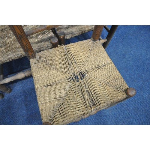 1212 - A SET OF SIX 20TH CENTURY OAK RUSH SEATED LADDERBACK CHAIRS, along with a single carver (condition -... 