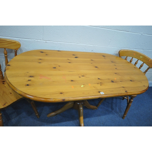 1235 - AN OVAL PINE PEDESTAL TABLE, length 153cm x depth 76cm x height 76cm, along with a set of four Yorvi... 