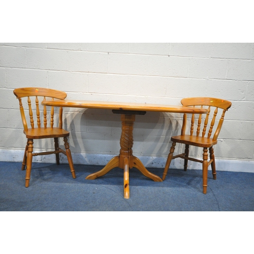 1235 - AN OVAL PINE PEDESTAL TABLE, length 153cm x depth 76cm x height 76cm, along with a set of four Yorvi... 