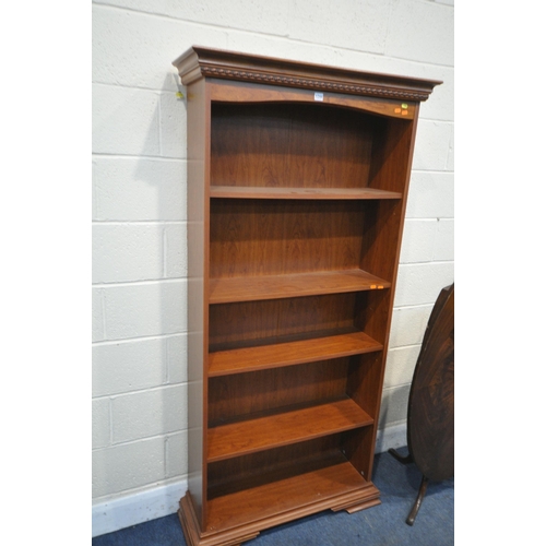 1244 - A 20TH CENTURY MAHOGANY BUREAU, the fall front door enclosing a fitted interior, above three drawers... 