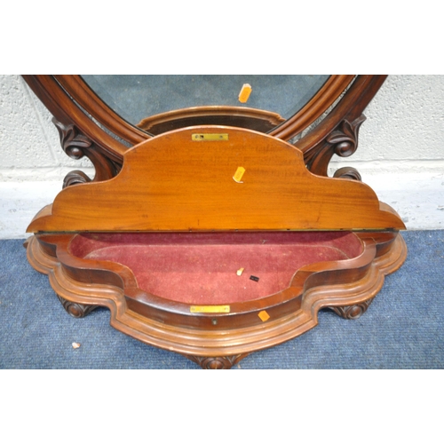 1245 - A VICTORIAN FLAME MAHOGANY OVAL BEVELLED EDGE SWING TOILET MIRROR, with foliate details, with a cent... 