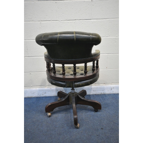 1251 - A REPRODUCTION MAHOGANY CAPTAINS CHAIR, with buttoned green leather upholstery (condition - general ... 