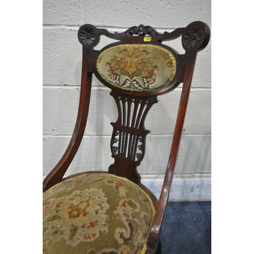 1256 - A VICTORIAN MAHOGANY SALON CHAIR, with scrolled crest, shaped back rest, with green floral upholster... 