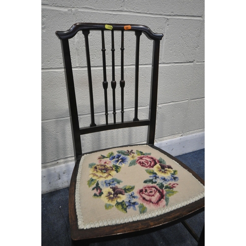 1256 - A VICTORIAN MAHOGANY SALON CHAIR, with scrolled crest, shaped back rest, with green floral upholster... 