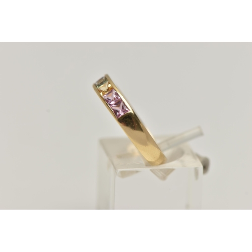 11 - AN 18CT GOLD MULTI GEM RING, set with seven square cut gems in a channel setting, including sapphire... 