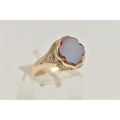 13 - A LATE VICTORIAN MEMORIAL RING, the scalloped shape front set with carnelian, opening to reveal a va... 