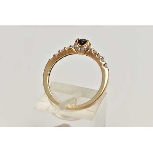 2 - A DIAMOND RING, designed as a central brilliant cut treated black diamond in a four claw setting wit... 