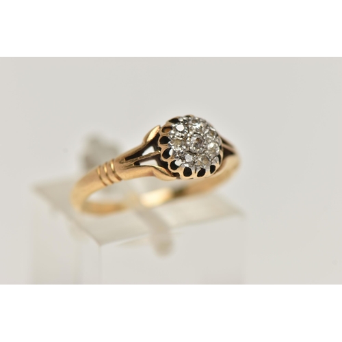 26 - A YELLOW METAL DIAMOND CLUSTER RING, small circular cluster of single cut diamonds, within an openwo... 