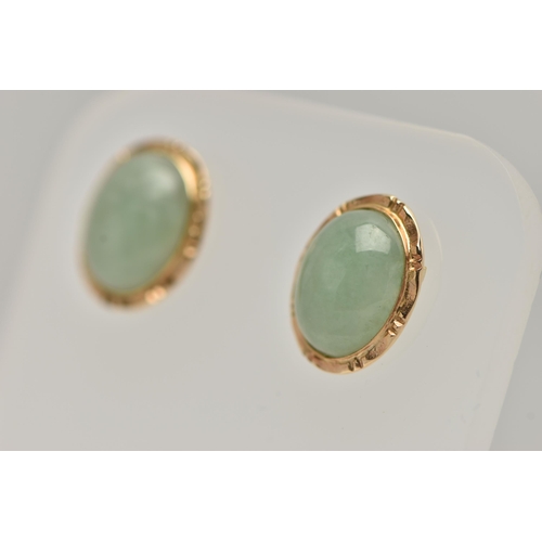 33 - A PAIR OF YELLOW METAL JADE STUD EARRINGS, of an oval form, set with an oval cut jade cabochon, coll... 