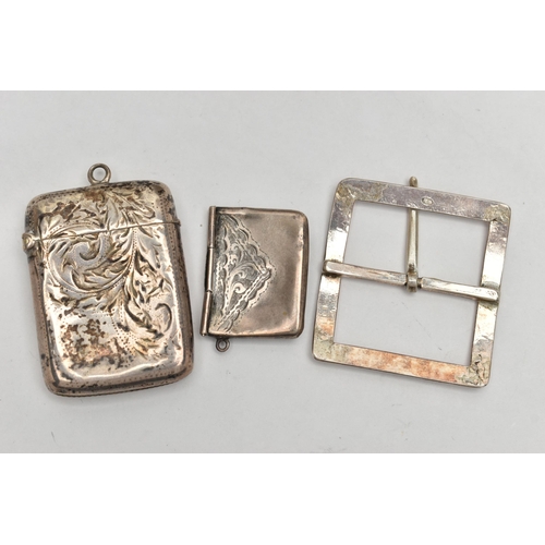 36 - A SILVER VESTA CASE, STAMP HOLDER AND A BELT BUCKLE, the rounded rectangular vesta case, decorated w... 