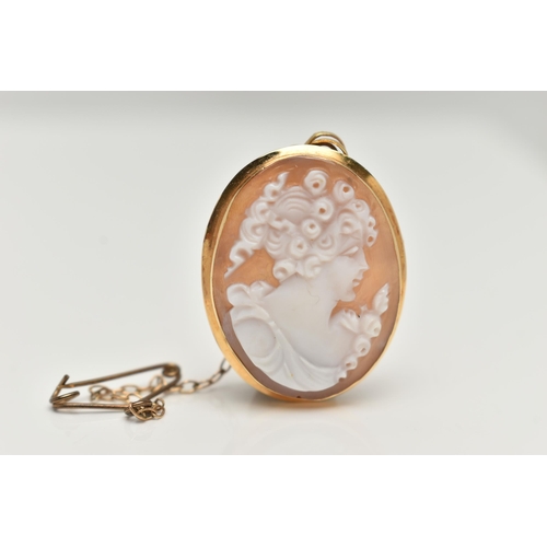 49 - A CAMEO BROOCH PENDANT, oval shell cameo depicting a ladys profile, collet set in yellow metal, fitt... 