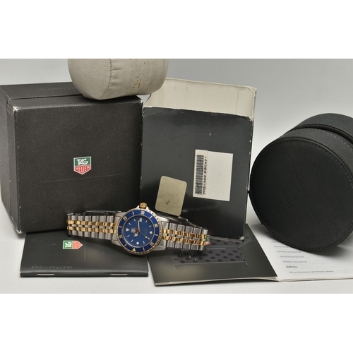 55 - A 'TAG HEUER' WRISTWATCH, quartz movement, round blue dial, signed 'Tag Heuer' baton markers, dot ma... 