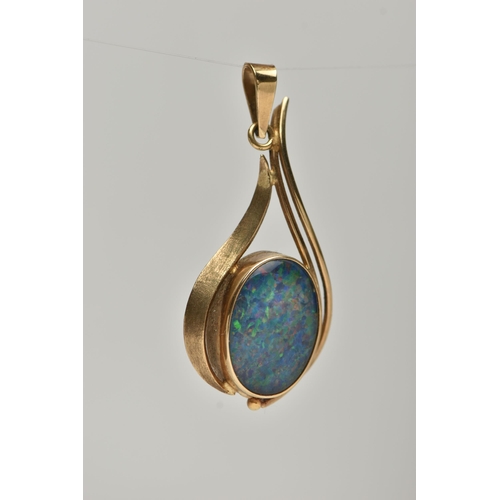 6 - A GEM PENDANT, designed as an oval opal triplet in a collet setting with abstract pear shape surroun... 