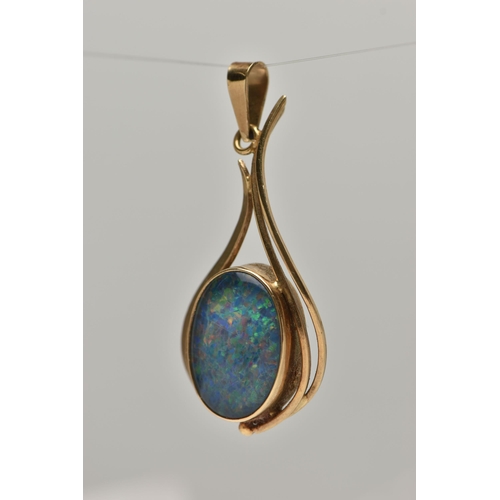 6 - A GEM PENDANT, designed as an oval opal triplet in a collet setting with abstract pear shape surroun... 