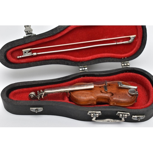 94 - A MINATURE 'SACCHETTI' VIOLIN, a cased violin with silver embellishments, approximate length of case... 