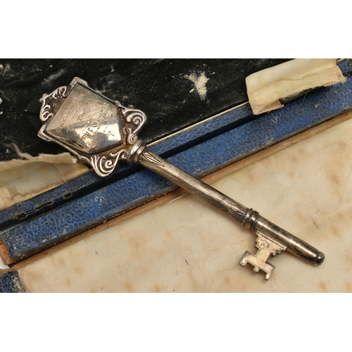 101 - A CASED GEORGE V SILVER PRESENTATION KEY, engraved ' PRESENTED TO MRS W.E. SANGSTER ROUPELL PARK MET... 