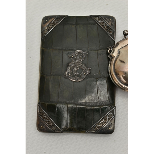 102 - A LATE VICTORIAN SILVER MOUNTED GREEN CROCODILE SKIN WALLET AND A SMALL GEORGE V SILVER PURSE ON CHA... 