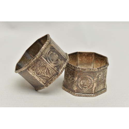 105 - A PAIR OF LATE VICTORIAN SILVER OCTAGONAL NAPKIN RINGS, alternate engine turned and engraved panels,... 