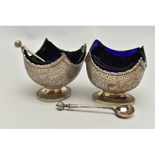 106 - A PAIR OF VICTORIAN SILVER PEDESTAL SALTS IN THE INDIAN TASTE, of shaped square form with engraved d... 
