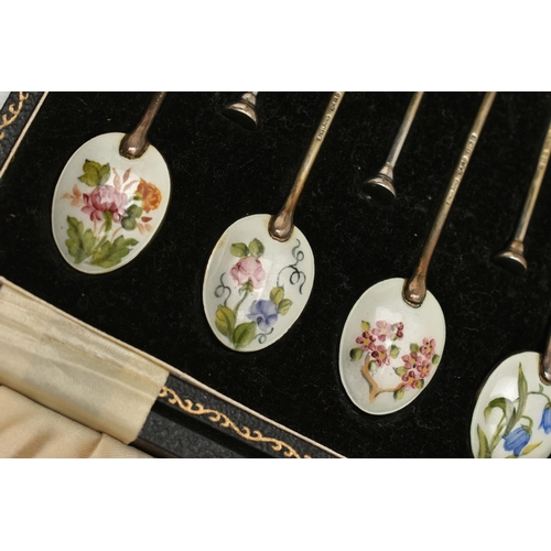 111 - CUNARD INTEREST, A CASED SET OF TWELVE SILVER AND ENAMEL COFFEE SPOONS AND A SIGNED CUNARD QUEEN MAR... 