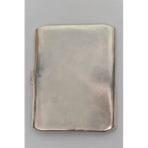 113 - A GEORGE VI SILVER CIGARETTE CASE OF RECTANGULAR FORM, canted corners, engine turned decoration to f... 