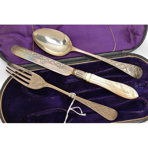 115 - A VICTORIA I SILVER CHRISTENING SET, a silver knife fork and spoon, decorated with bright cut detail... 