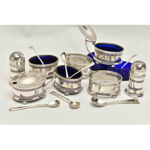 120 - AN EIGHT PIECE SILVER CONDIMENT SET, comprising of four pierced salts each on four ball feet with bl... 