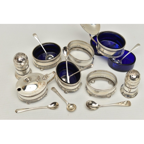 120 - AN EIGHT PIECE SILVER CONDIMENT SET, comprising of four pierced salts each on four ball feet with bl... 