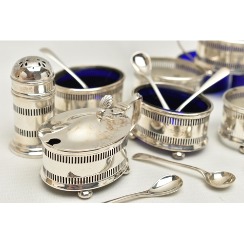 120 - AN EIGHT PIECE SILVER CONDIMENT SET, comprising of four pierced salts each on four ball feet with bl... 