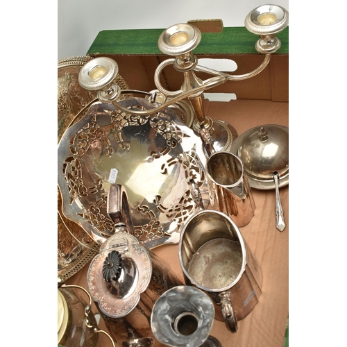 144 - A BOX OF MAINLY SILVER PLATED WARE, to include a pair of chambersticks, a dressing table set, a cand... 