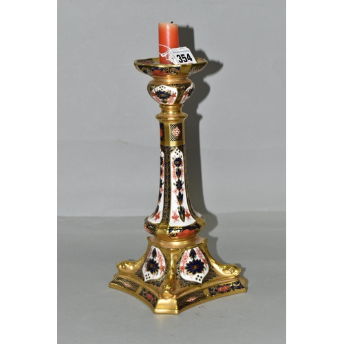 354 - A ROYAL CROWN DERBY OLD IMARI 1128 SOLID GOLD BAND  CANDLESTICK, heavily gilded with dolphin detail ... 