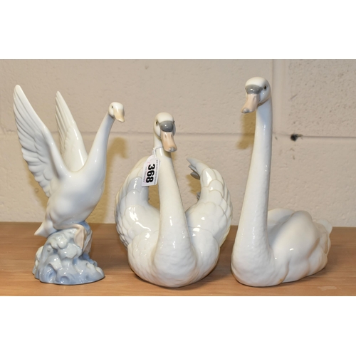 368 - TWO LLADRO SWANS AND A NAO DUCK, comprising a Swan with wings spread, no 5231, issued 1984-2004, scu... 