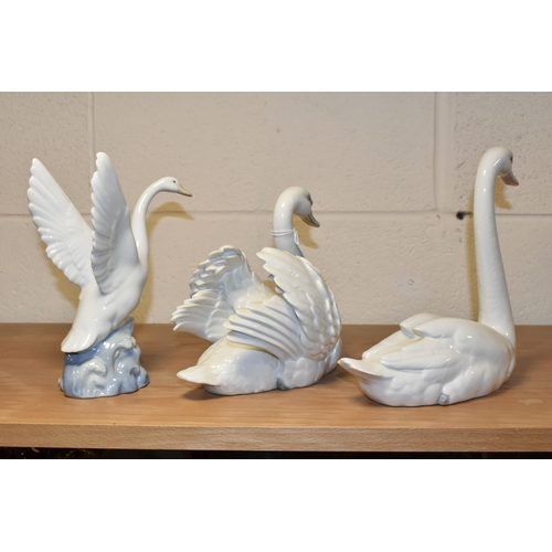 368 - TWO LLADRO SWANS AND A NAO DUCK, comprising a Swan with wings spread, no 5231, issued 1984-2004, scu... 