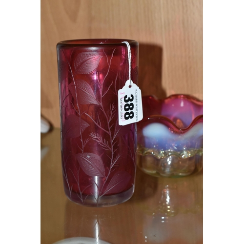 388 - TWO PIECES OF CRANBERRY GLASS, to include a cylindrical vase etched with leaves, signed '(Jonathan?)... 