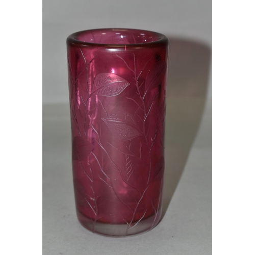 388 - TWO PIECES OF CRANBERRY GLASS, to include a cylindrical vase etched with leaves, signed '(Jonathan?)... 