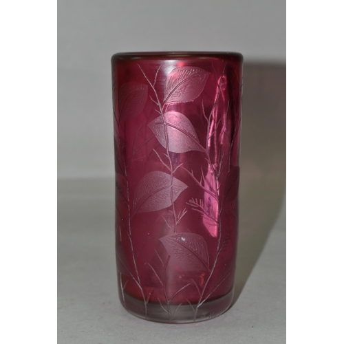 388 - TWO PIECES OF CRANBERRY GLASS, to include a cylindrical vase etched with leaves, signed '(Jonathan?)... 