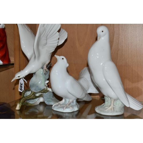 389 - TWO LLADRO DOVES, A NAO DOVE AND A NAO CAT, comprising Lladro Turtle Dove, model no 4550, perched on... 