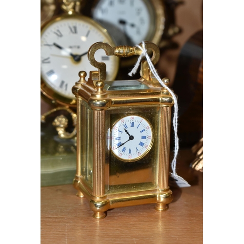 391 - A COLLECTION OF SMALL CLOCKS, to include a miniature glass cased carriage clock with visible movemen... 