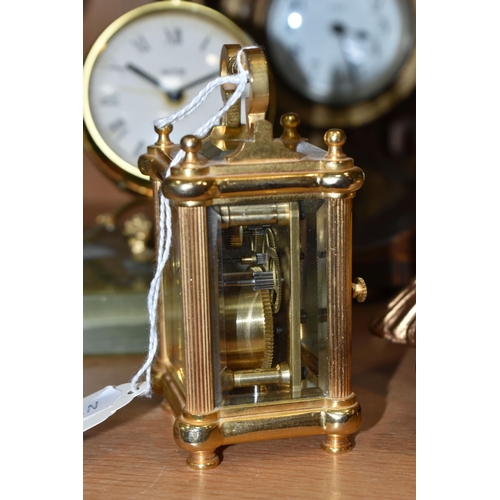 391 - A COLLECTION OF SMALL CLOCKS, to include a miniature glass cased carriage clock with visible movemen... 