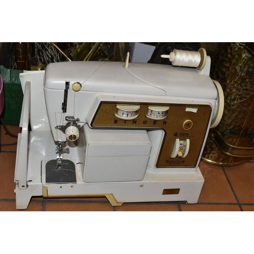 415 - FOUR BOXES OF MISCELLANEOUS SUNDRIES, to include a 1960's Singer sewing machine 700/720 with instruc... 