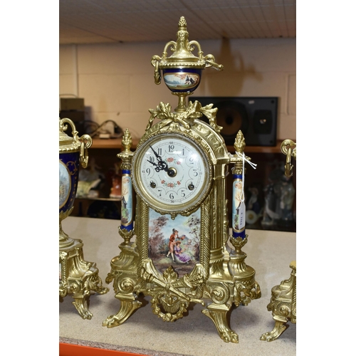 416 - A 20TH CENTURY BRASS AND PORCELAIN CLOCK GARNITURE, the porcelain panels transfer printed with coupl... 