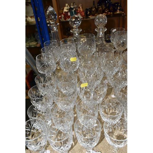 420 - A COLLECTION OF CUT CRYSTAL, all of a similar pattern comprising a set of six white wine glasses, si... 