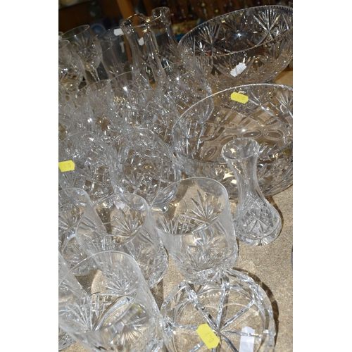 420 - A COLLECTION OF CUT CRYSTAL, all of a similar pattern comprising a set of six white wine glasses, si... 