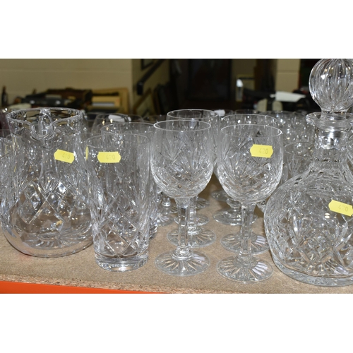 420 - A COLLECTION OF CUT CRYSTAL, all of a similar pattern comprising a set of six white wine glasses, si... 